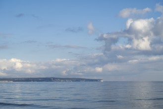 View across the Baltic Sea towards the chalk coast, sky with white clouds, Binz, seaside resort,