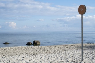 Naturist sign on the beach, sandy beach, sea, white clouds in the sky, Binz, seaside resort, Rügen