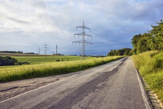Landscape, road, high-voltage power line, high-voltage pole, television tower, fields, trees,