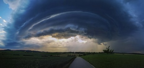Supercell, approaching thunderstorm with impressive and threatening cloud formation of a