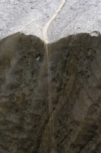 Meltwater at a glacier cave, underground glacier stream, Castner Glacier, Delta Range, Alaska