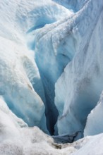 Waterfall in a crevasse on the ice of Root Glacier, Wrangell St. Elias National Park, Alaska, USA