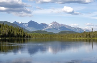 Mountains are reflected in idyllic Crystal Lake, McCarthy Highway, Wrangell St. Elias National
