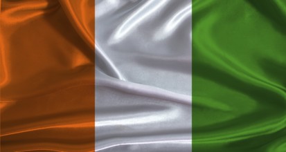 Ivory Coast flag with cloth textured background. National flag of Ivory Coast with realistic