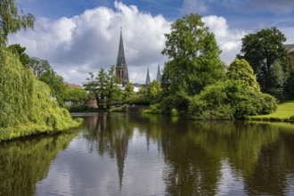 View of St. Lambert's Church from the castle pond in the castle park in Oldenburg, Oldenburg, Lower