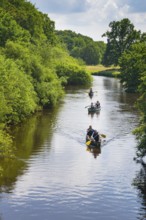 Canoeists do water sports on the Hunte near Astrup, Barneführer Holz, Wardenburg, Lower Saxony,