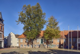 City museum, historic town hall, brick building, facade with windows, museum, staircase, square of