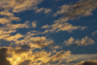 Small clouds in sunset on blue sky, Austria
