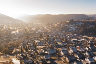 Overview of a village with wintry roofs and hills, Glatten, Freudenstadt district, Germany