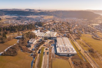 Industrial area near a town in a hilly winter landscape, Glatten, Freudenstadt district, Germany