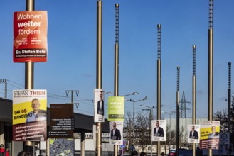 Mayor election in Böblingen. Election posters of OB candidates are hanging in front of the train