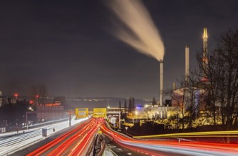 Federal road B10 B14 in the evening with light trails. Stuttgart-Gaisburg CHP plant operated by