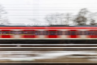 S-Bahn on the open route. motion blur. Esslingen, Baden-Württemberg, Germany