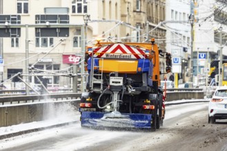 Winter in Stuttgart. There is a closed blanket of snow in the city center. Snowplow in winter
