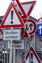 Storage for traffic signs in the yard of a road maintenance department, various signs with