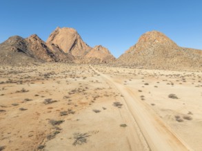 Aerial view, road and mountains in the desert, Spitzkoppe summit, Namib desert, Namibia
