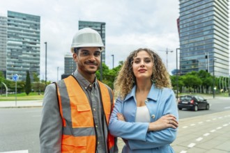 Building professionals smiling and standing on a city street, conveying teamwork, collaboration,