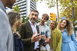 Diverse business professionals having an informal meeting on the street, actively engaging in
