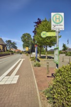 Bus stop Neuenkirchen Town Hall, general architecture, church, flagpoles, flags, sidewalk, street,