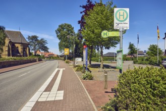 Bus stop Neuenkirchen Town Hall, general architecture, church, flagpoles, flags, sidewalk, street,