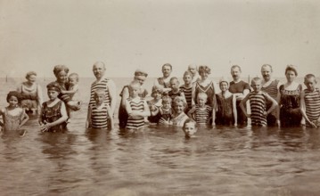 Digitally restored historical photograph of a group of bathers in the Baltic Sea near Göhren on the