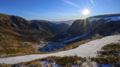 Snowy mountain landscape at sunrise, mountainous valley with clear sky, winter, Route de Cretes,