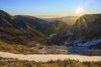 Snowy mountain valley in morning light with clear sky and light rays, morning, winter, Hohneck, La