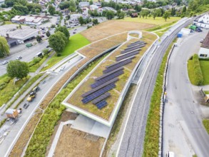 Modern solar roof construction in an urban environment, surrounded by infrastructure, new Park and