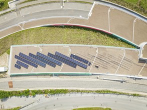 Top view of a roof area with installed solar system, aesthetically arranged, new park and ride