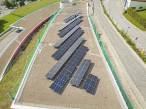 Solar panels on a green roof, surrounded by roads and buildings, new Park and Ride Calw Heumaden