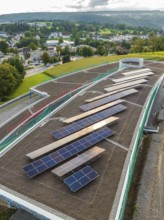 Solar panels on a roof with views of the city and surrounding hills, new Park and Ride Calw