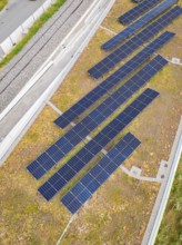 Roof area with several solar modules, surrounded by vegetation and rails, new Park and Ride Calw