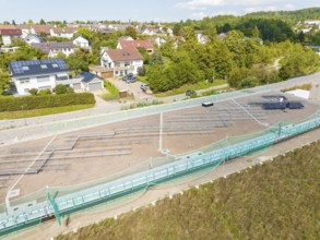 Construction site for solar systems in a quiet residential area with green areas and sun, new park