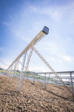 Close-up of a metal structure for solar modules under a clear blue sky, new park and ride car park