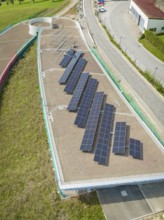 Large solar panels on roof in urban industrial park, new park and ride parking garage Calw Heumaden
