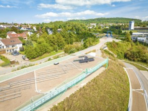 Overview of a village with a solar system in the neighborhood under blue skies, new Park and Ride