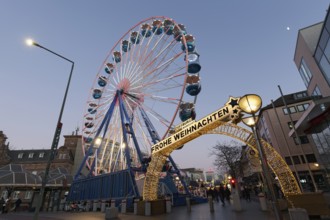 Duisburg Christmas market, illuminated entrance portal with Ferris wheel, twilight, Duisburg, North