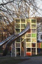 Children's playground with colorful climbing tower and slides, Immanuel-Kant-Park, Duisburg, North