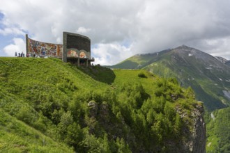 Cliffs with green vegetation and wall paintings, impressive natural scenery, Georgian-Russian