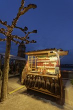 Illuminated chestnut stand at the Christmas market, roasted chestnuts, Düsseldorf Old Town,