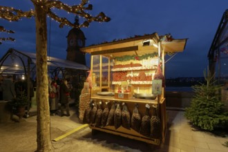 Illuminated chestnut stand at the Christmas market, roasted chestnuts, Düsseldorf Old Town,