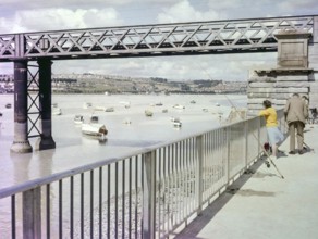 People fishing next to Laira Bridge railway bridge opened 1892, River Plym, Plymouth, Devon,