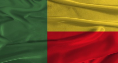Flag of Benin with fabric textured background. Close up of National flag of Benin with realistic