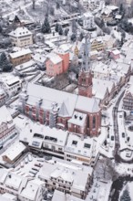 Snowy city view with dominant church in the center, Calw, Black Forest, Germany