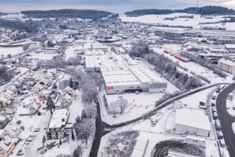 Aerial view of snowy industrial landscape with buildings and roads, Calw, Black Forest, Germany