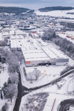 Snowy industrial view surrounded by trees and roads, in a winter landscape, Calw, Black Forest,