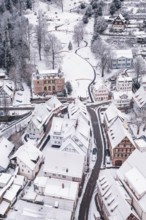 Small snowy town with snow-covered buildings and roads in winter, Calw, Black Forest, Germany