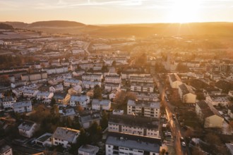 View of an urban landscape at sunset, with highly visible hills in the background, Calw, Black
