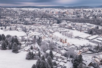 City in winter with snowy houses, trees and a vast landscape, Calw, Black Forest, Germany