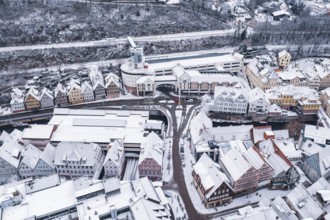 Aerial view of a snowy town with half-timbered houses and roads in winter, Calw, Black Forest,